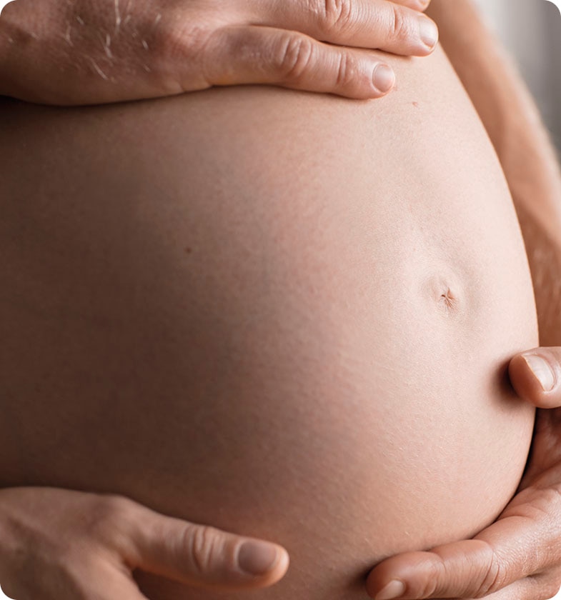 pregnant woman showing her belly