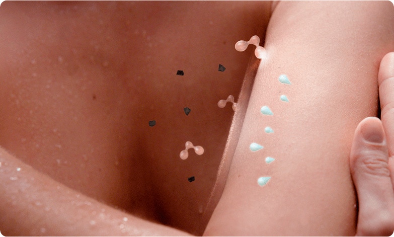 A hand touching an arm with microbiome icon reflecting from the skin